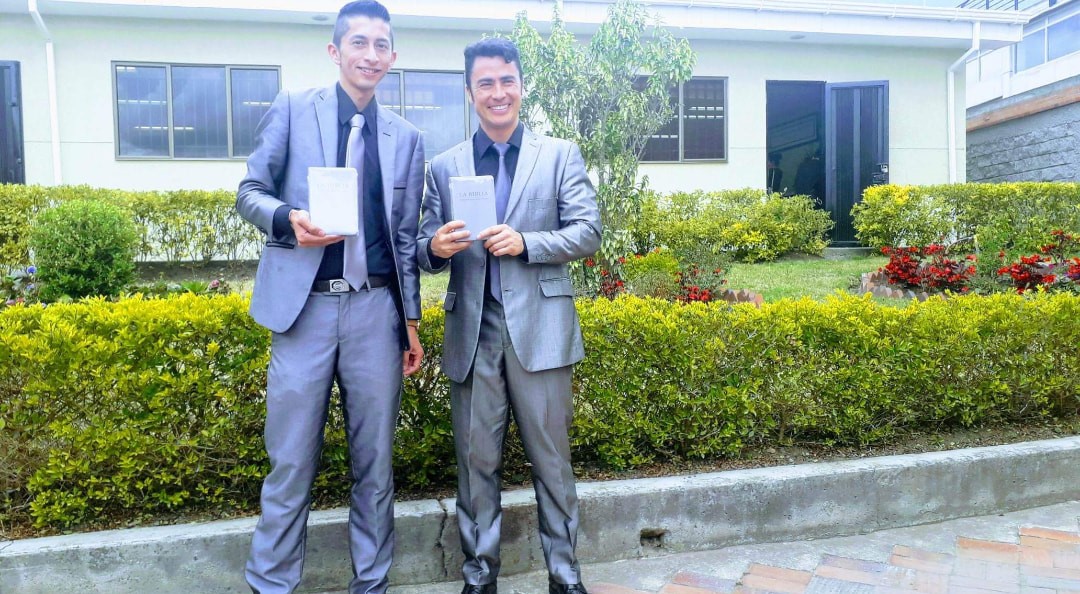 Members with Bibles at Kingdom Hall